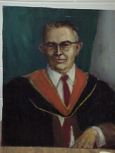 PORTRAIT OF MAN IN ACADEMIC ROBE